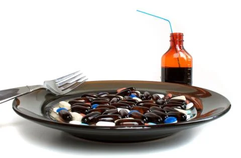 Pills for dinner up close Stock Photos