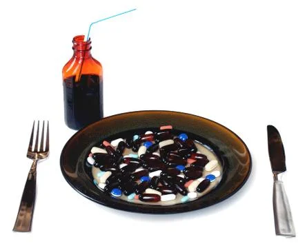 Pills for dinner Stock Photos