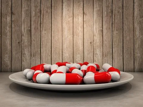 Pills on dish Stock Photos