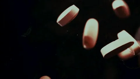 Pills Drop Against Black Background Stock Footage 300886079