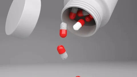 Pills droping from a bottle on greay background animation Stock Footage 72062541