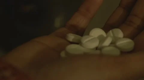 Pills dropping off the hand Stock Footage 12722188