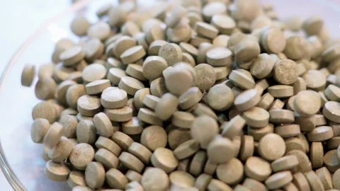 Pills dropping white background slowmotion 100fps Stock-Footage 156169393