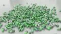 Pills drugs capsules falling on white table counter top slow motion closeup 4K 4k or 4k+ Resolution
