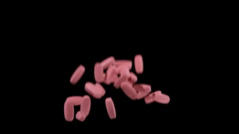 The pills fall on a black background. Pink pills. Close up. Slow motion Stock Footage 135121696