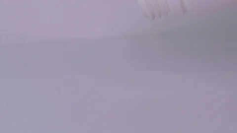 Pills fall out from bottle on a white background Stock Footage 129607007