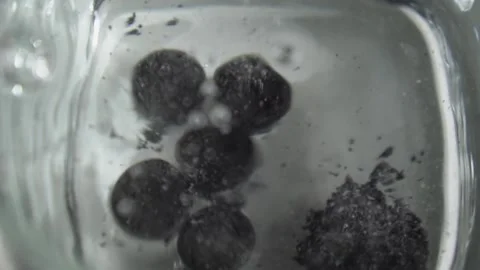 Pills fall into the water Stock Footage 244764941