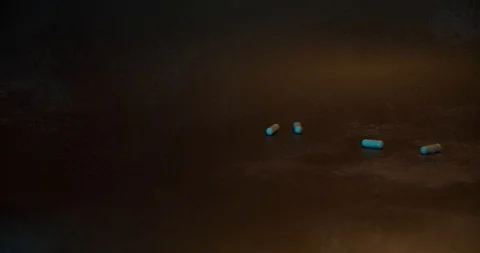 Pills fall on wooden table Stock Footage 126328664