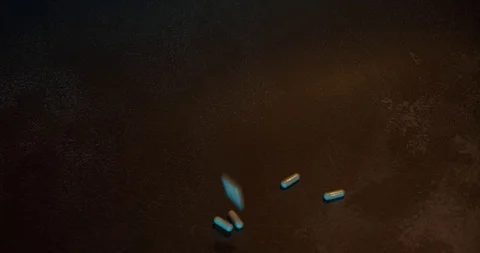 Pills fall on wooden table Stock Footage 126329035