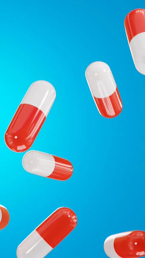 Pills falling on a blue background. 3D looped video Stock Footage 265807169