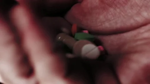 Pills falling in an open palm. Stock Footage 82877672
