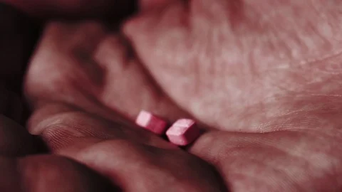 Pills falling in an open palm. Stock Footage 82877833