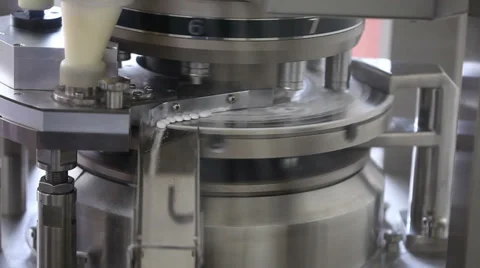 Pills falling out of pill manufacturing machine Stock Footage 36636656