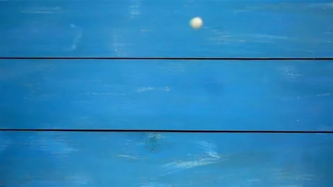 Pills falling in slow motion on blue Stock Footage 136543940