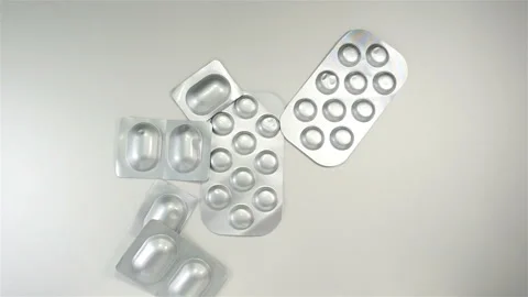 Pills falling in slow motion Stock Footage 148104706