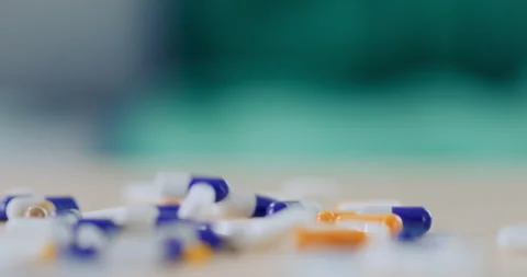 Pills Falling in Slow Motion Stock Footage 276223537