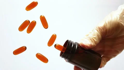 Pills falling in slow motion. Pharmaceutical bottle Stock Footage 167218017