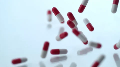 Pills falling in slow motion; shot on Phantom Flex 4K at 1000 fps Stock Footage 55662580