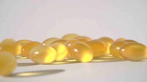 Pills falling on white background top view in slow motion Stock Footage 85627056
