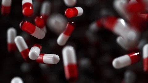 Pills fly after being exploded. Slow Motion. Stock Footage 79733112