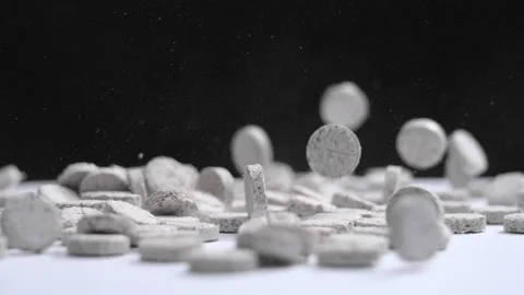 Pills with food additives fall down in slow motion Video stock 169232010