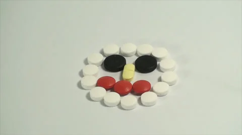 Pills Forming A Face On A White Background, Medical, Medicine, Cure, Treatment Stock Footage 39351500