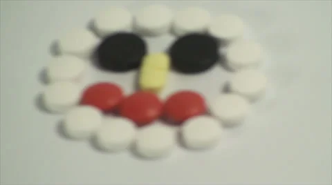 Pills Forming A Face On A White Background, Medical, Medicine, Cure, Treatment Stock Footage 39351513