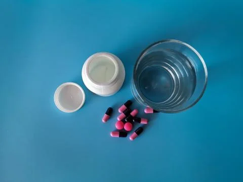 Pills in a glass Stock Photos