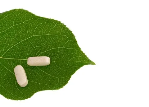 Pills on green leaf Foto stock