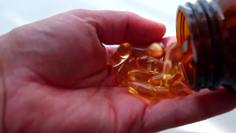 Pills in hand close up Stock-Footage 204710762