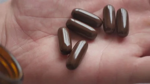 Pills in the hand. Stock Footage 84760723