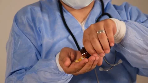 Pills into hand Stock Footage 255143248