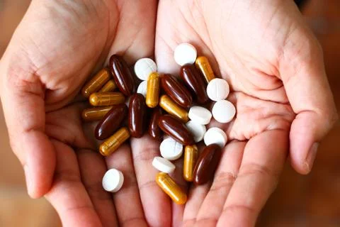 Pills on hand Stock Photos
