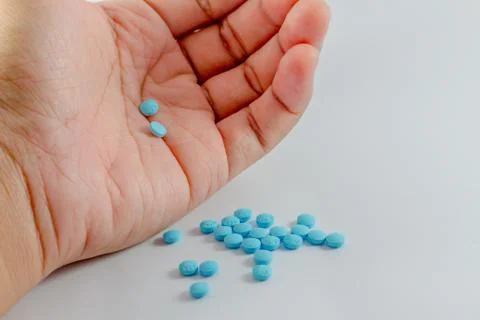 Pills in hand. Stock Photos