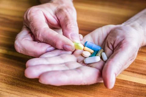 Pills in hand Stock Photos