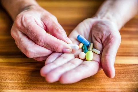 Pills in hand Stock Photos