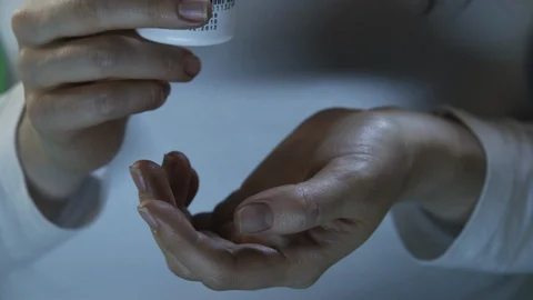 Pills on hand, taking pills 스톡 동영상 112125211