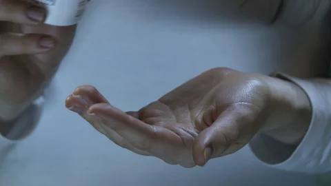 Pills on hand, taking pills 스톡 동영상 112125660