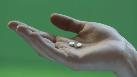Pills on hand, taking pills 스톡 동영상 112126571