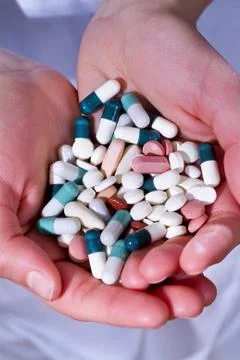 Pills in the hands Stock Photos