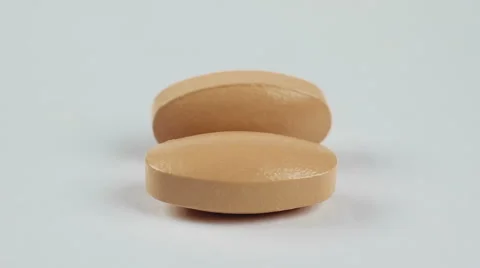 Pills isolated on white background, macro closeup rotation Video stock 53789718