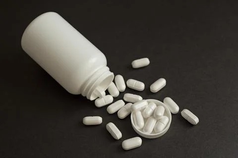 Pills in a jar Stock Photos