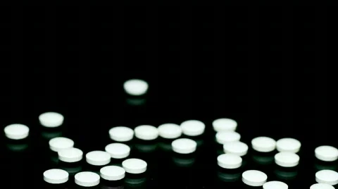 Pills jumping up Stock Footage 876763
