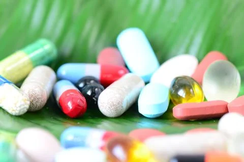 Pills on a leaf Stock Photos