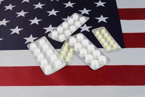 Pills lie on us flag, close-up, selective focus Foto stock