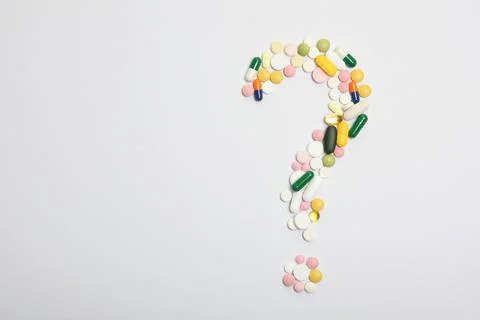 Pills on a light background top view. Medicine, treatment, illness. Stock-Fotos
