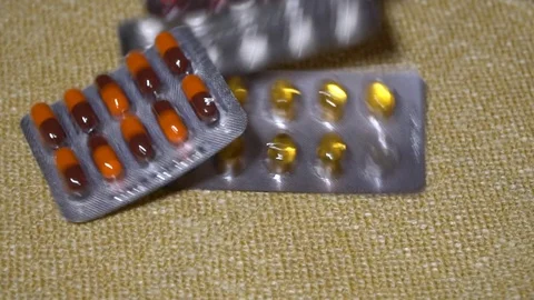 Pills. Medication closeup. Blisters with multi-colored tablets and capsules Stock Footage 99405474