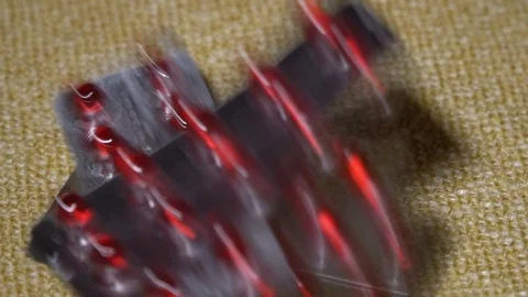 Pills. Medication closeup. Blisters with red round capsules slowly fall on a Stock Footage 99441137