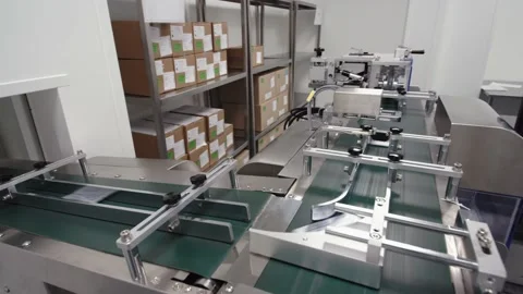 Pills in a package move along a conveyor belt. the final stage of drug Stock Footage 199683823
