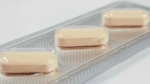 Pills packed on white background, macro closeup rotation. 스톡 동영상 54922371